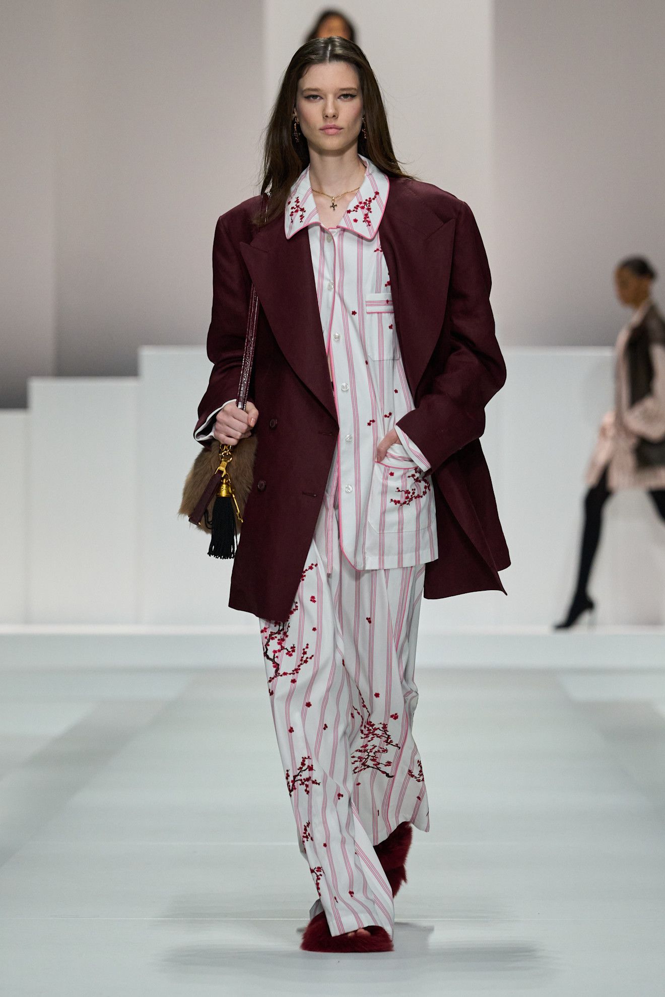 Women on dolce & Gabbana runway show wearing pajama-inspired outfits.
