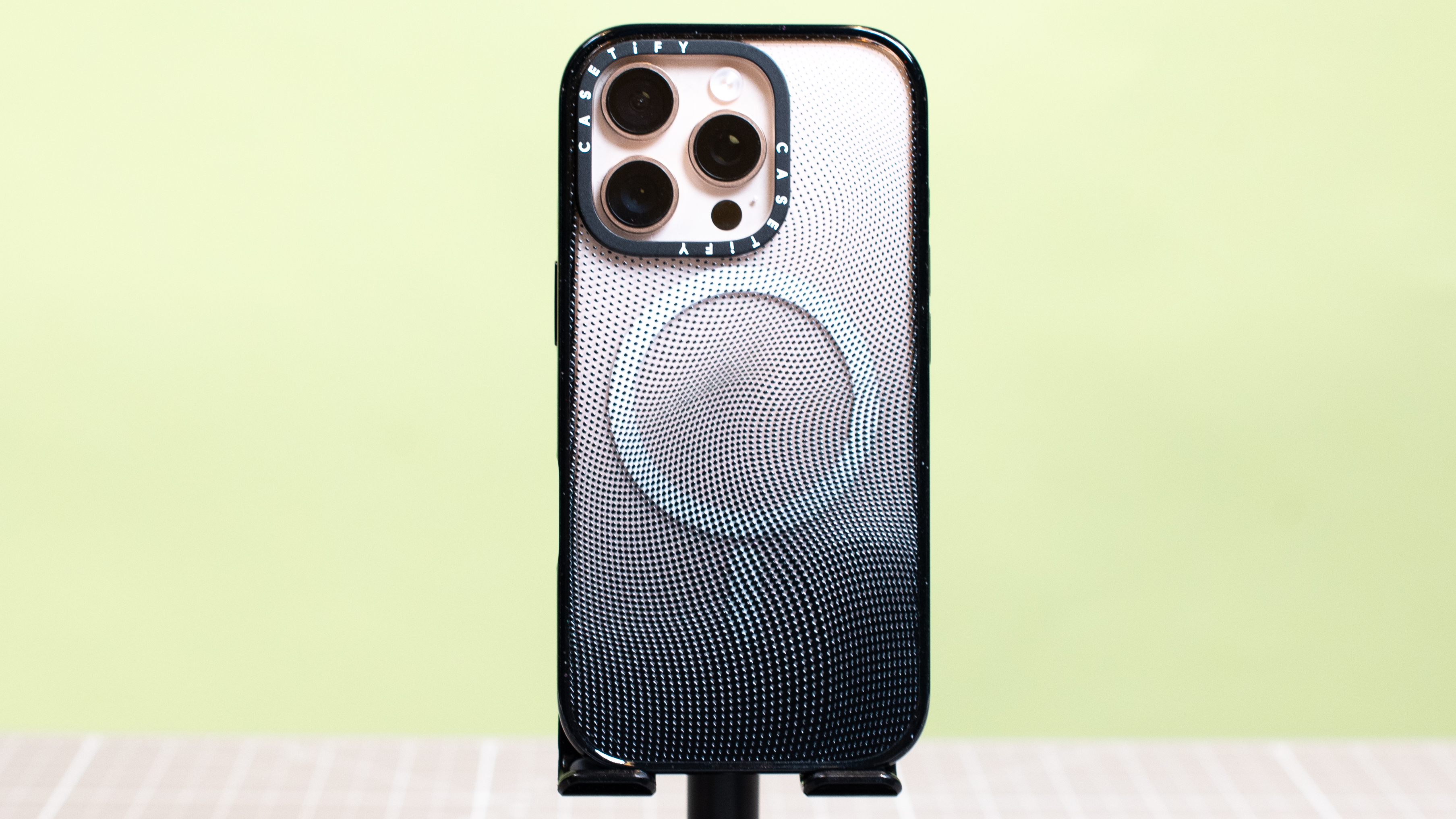 Casetify Impact Apple iPhone 16 Pro case with magsafe rings and iPhone 16 Pro in desert titanium inside