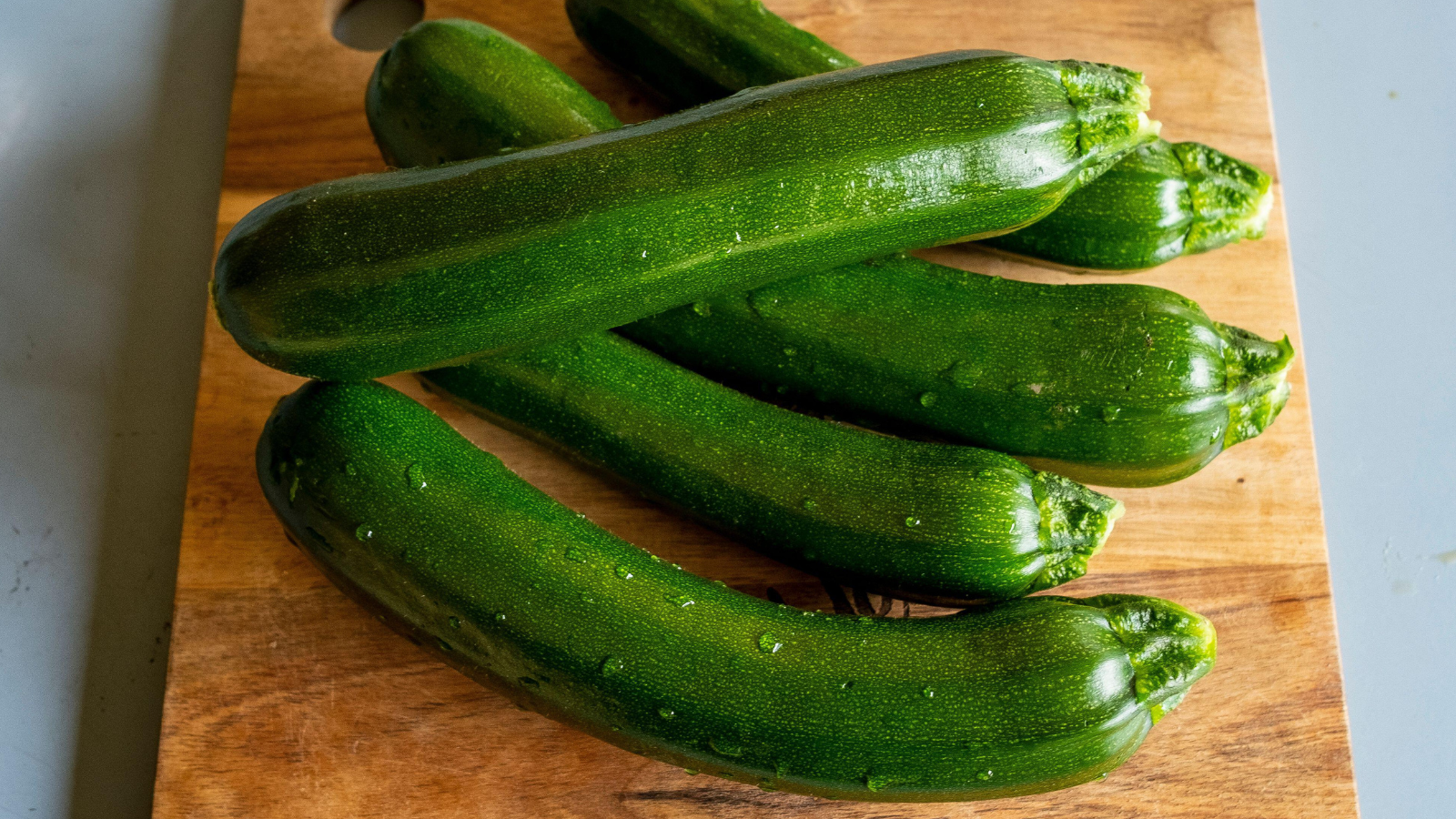 fresh picked zucchini from the garden on a wooden board