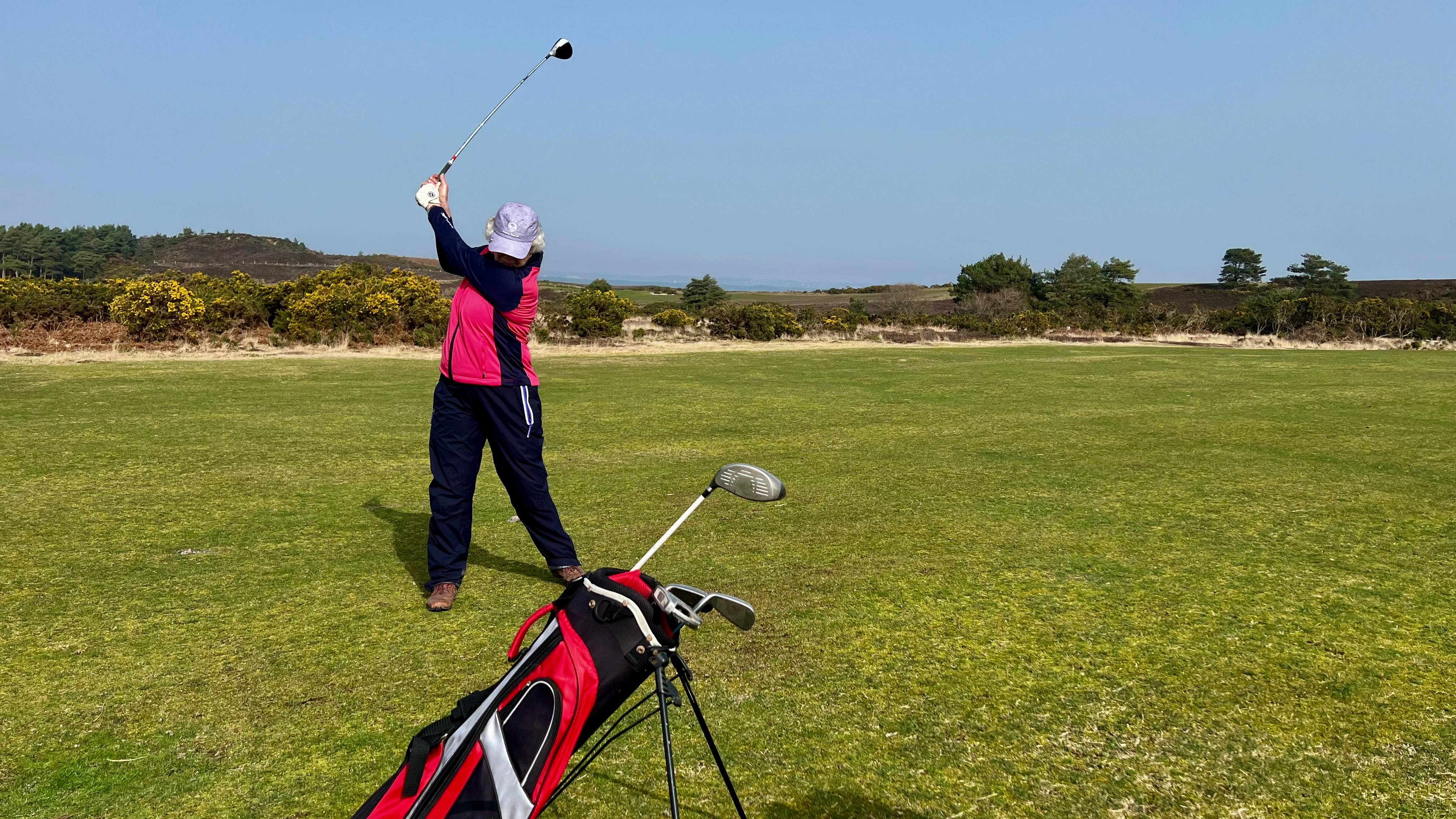 Female beginner golfer