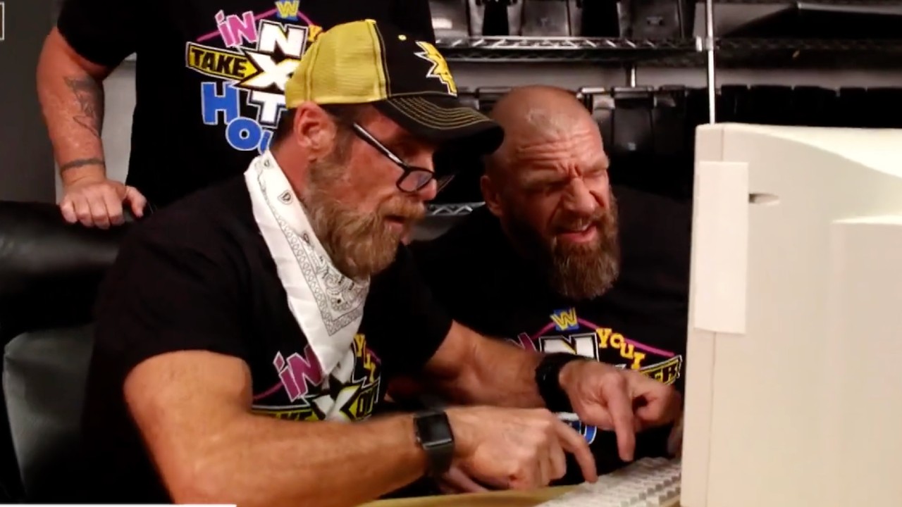 Triple H and Shawn Michaels attempting to use a computer