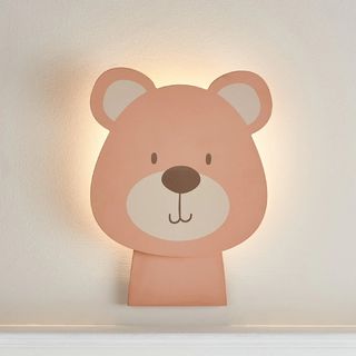 wall light in shape of bear's head decorated with bear face