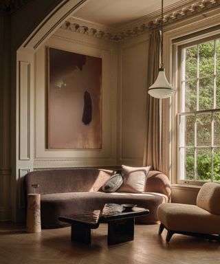 sitting room with curved fabric sofa and armchair