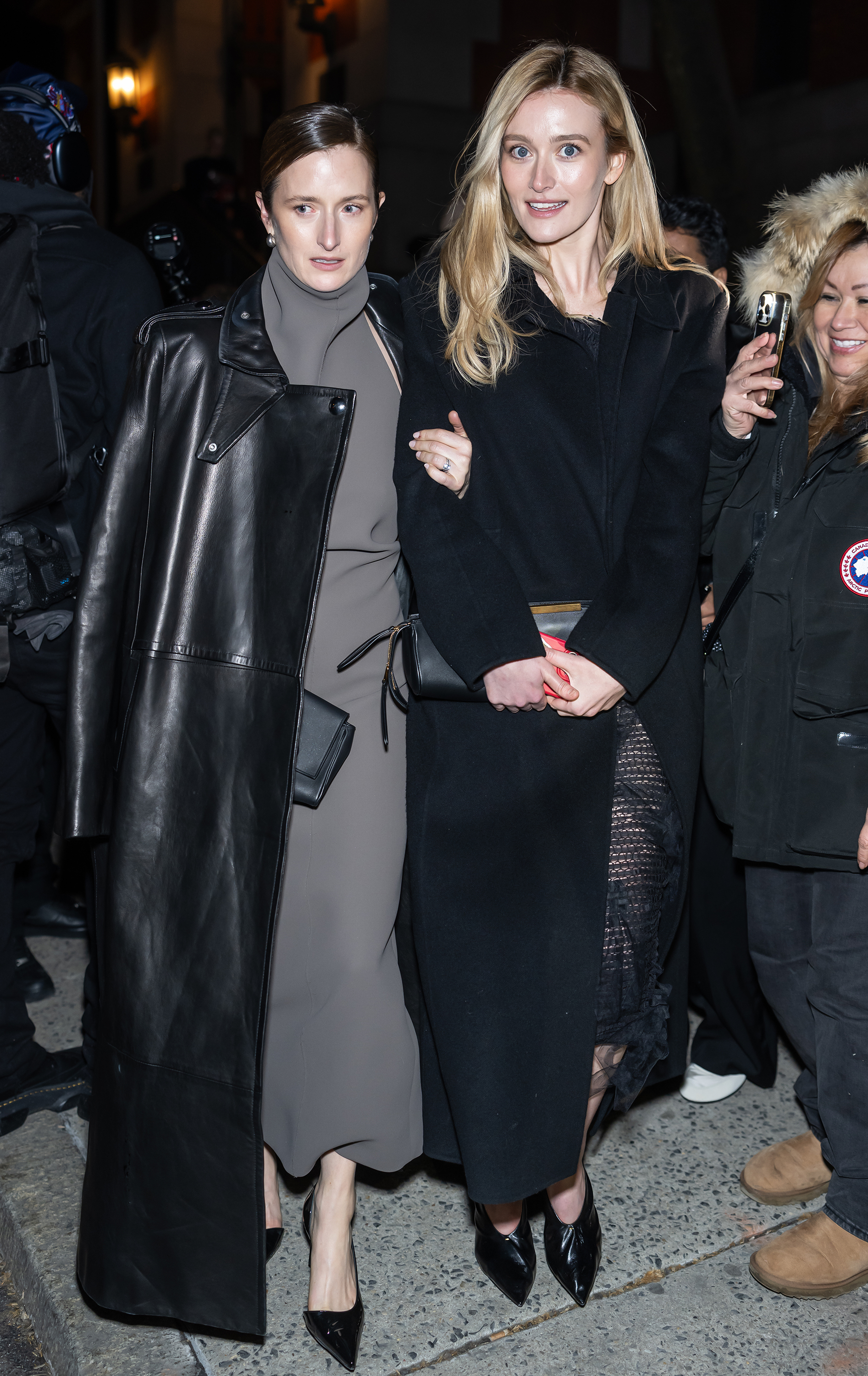 Grace Gummer and Sarah Pidgeon attend the Khaite fashion show during New York Fashion Week on February 14, 2026 wearing a sleek black outfit seemingly inspired by Carolyn Bessette-Kennedy's timeless '90s minimalism