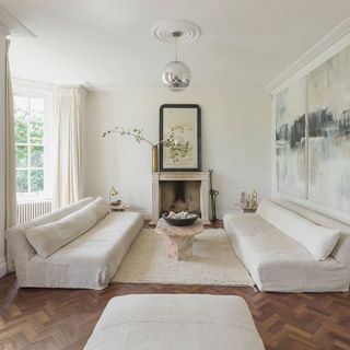 living room with white walls and white windows