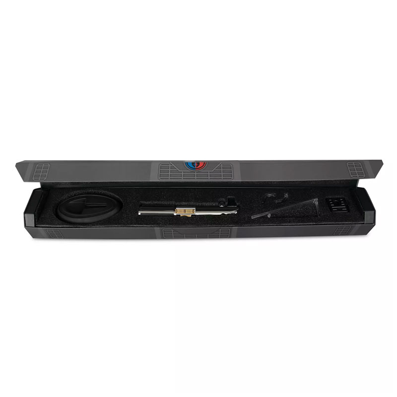 A metal hilt for a lightsaber lies in a case with a black foam protective interior.