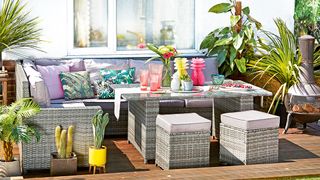 An outdoor sofa set with bright tropical accents