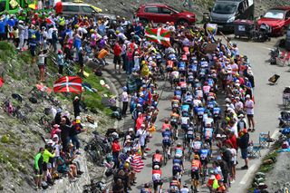 SAINTLARYSOULAN PLA DADET FRANCE JULY 13 A general view of the peloton compete climbing to the Hourquette dAncizan 1566m during the 111th Tour de France 2024 Stage 14 a 1519km stage from Pau to SaintLarySoulan Pla dAdet 1653m UCIWT on July 13 2024 in SaintLarySoulan Pla dAdet France Photo by Dario BelingheriGetty Images