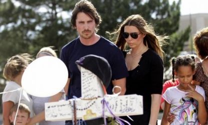 Actor Christian Bale and his wife Sandra Blazic visit the memorial across the street from the Century 16 movie theater in Aurora, Colo., where 12 people were shot dead as they watched Bale's 