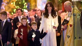 Catherine, Princess of Wales, Prince Louis of Wales, Princess Charlotte of Wales and Prince George of Wales process out of The "Together At Christmas" Carol Service