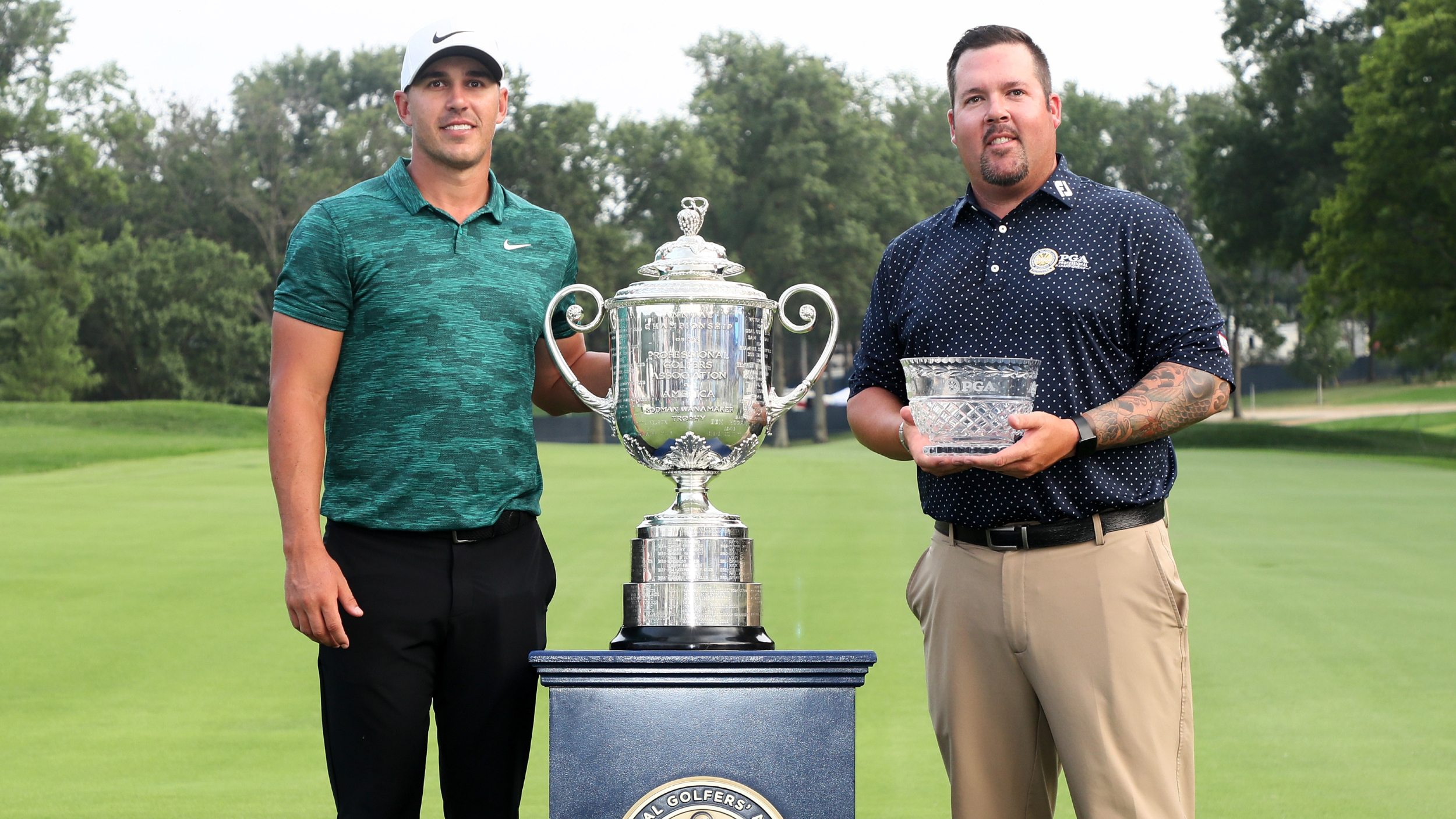 Brooks Koepka and Ben Kern photographed with their trophies at the 2018 PGA Championship