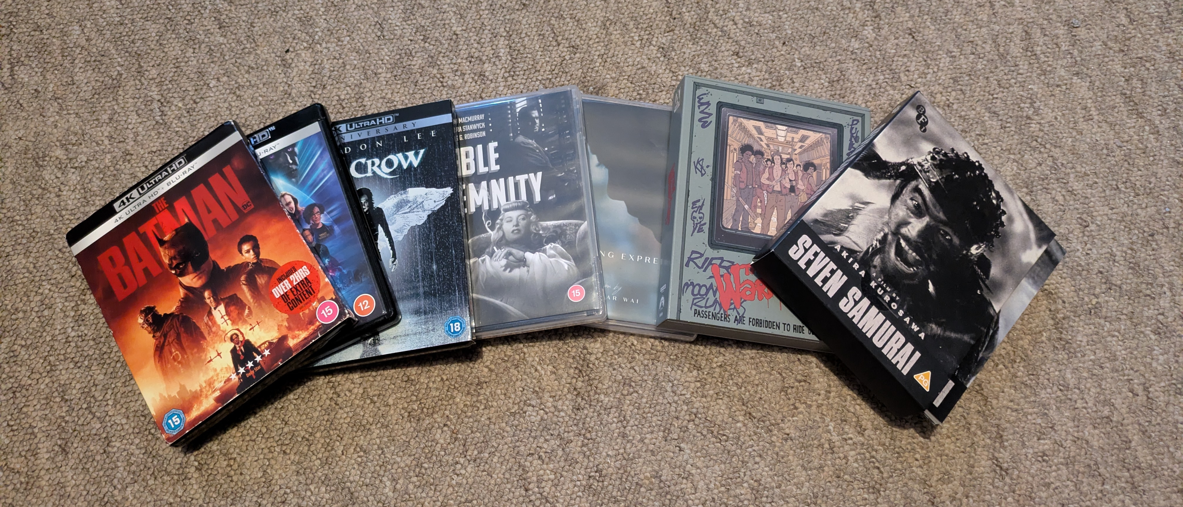 Image of various 4K Blu-rays on floor 