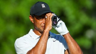 Tiger Woods using a rangefinder at the PGA Championship