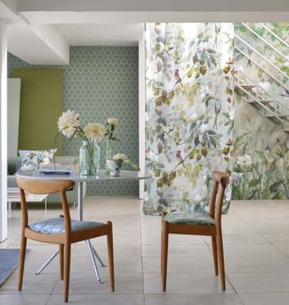 Matching wallpaper and cushions in a dining room