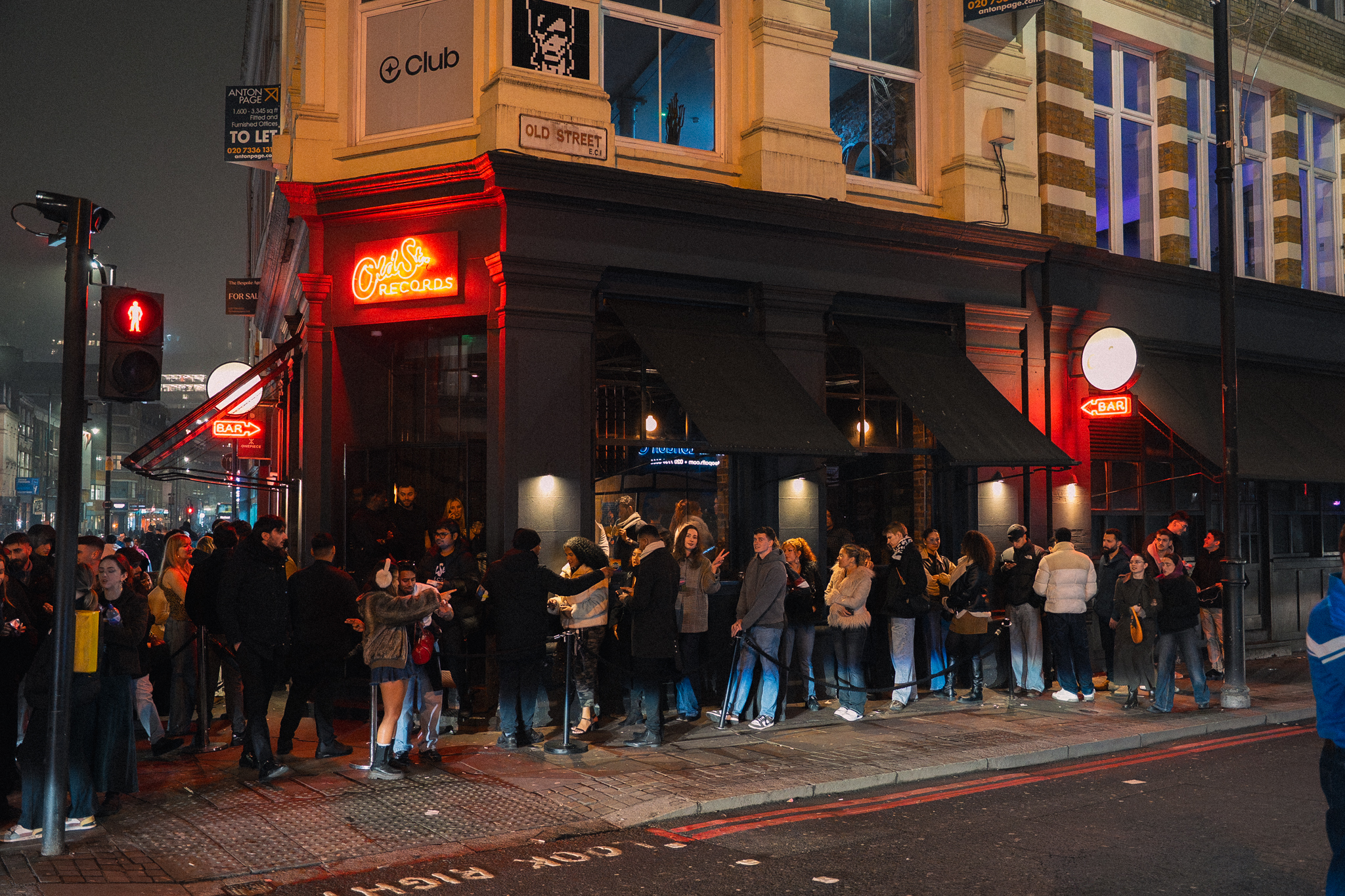 an image of the exterior of Old Street Records with a queue snaking around the corner