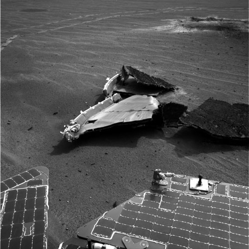 Mars Rover Wanders Through Littered Landscape