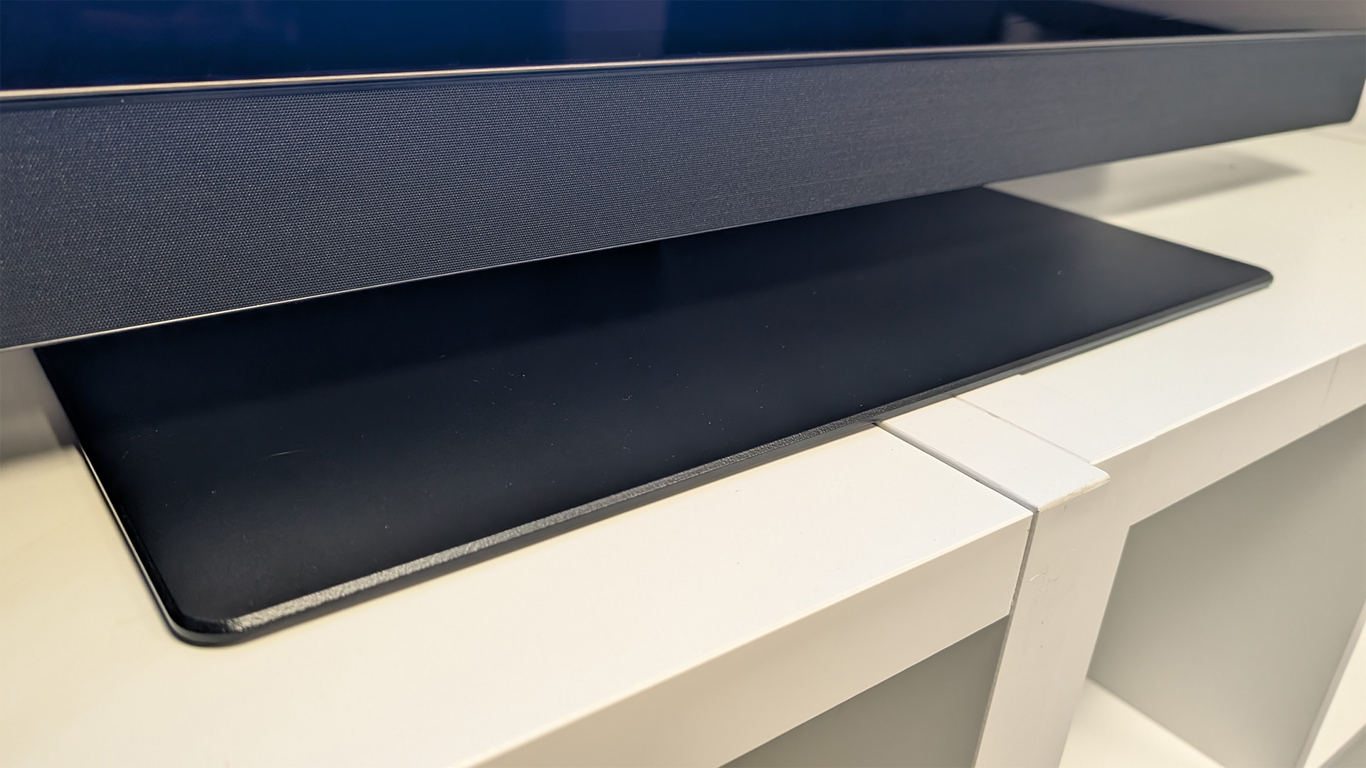 Panasonic Z90B 48-inch OLED TV detail of bottom soundbar and pedestal stand