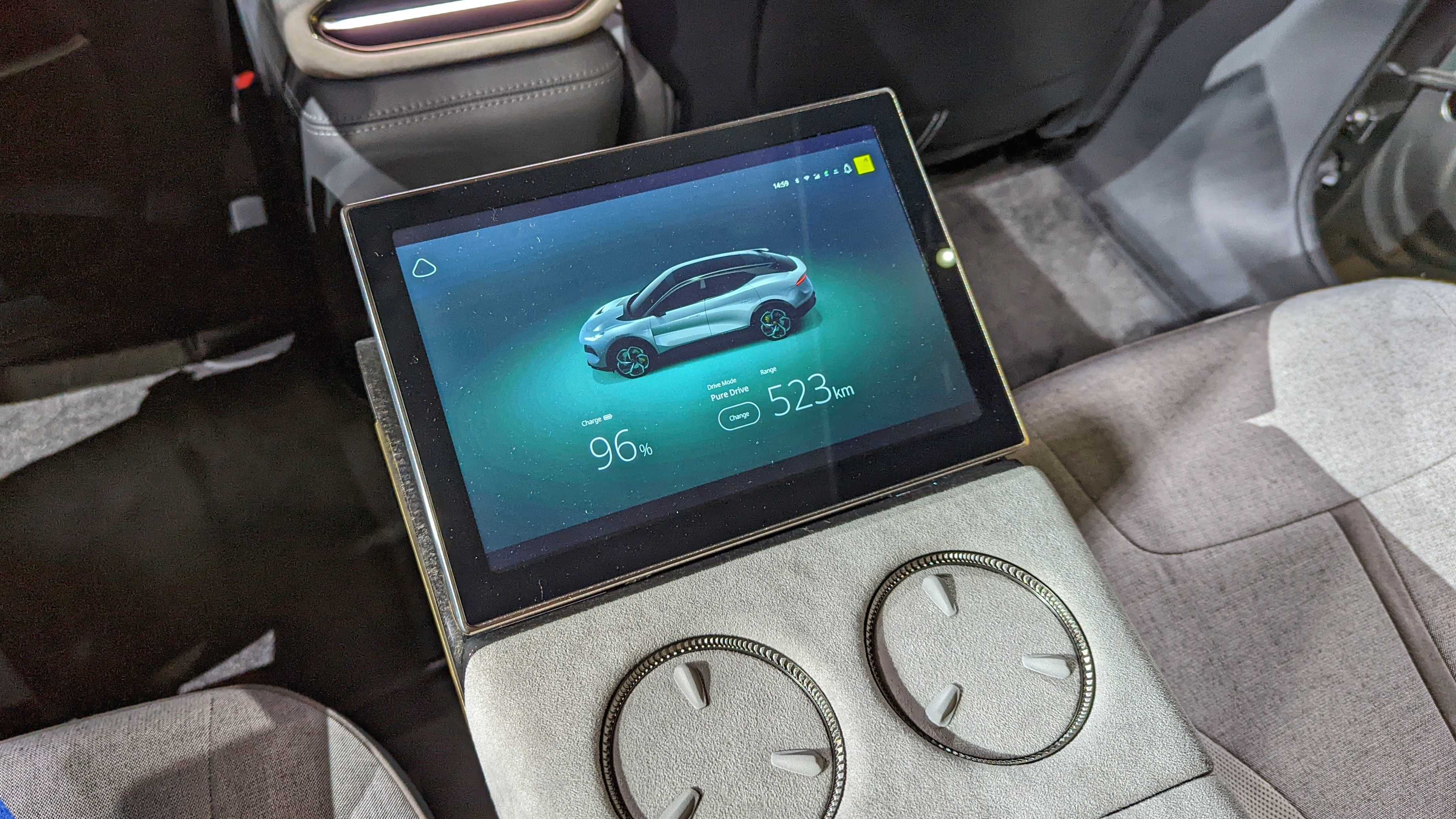 Close-up of the screen on the armrest between the rear seats of the Lotus Eletre