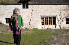 Becky Wasserman-Hone in front of farmhouse