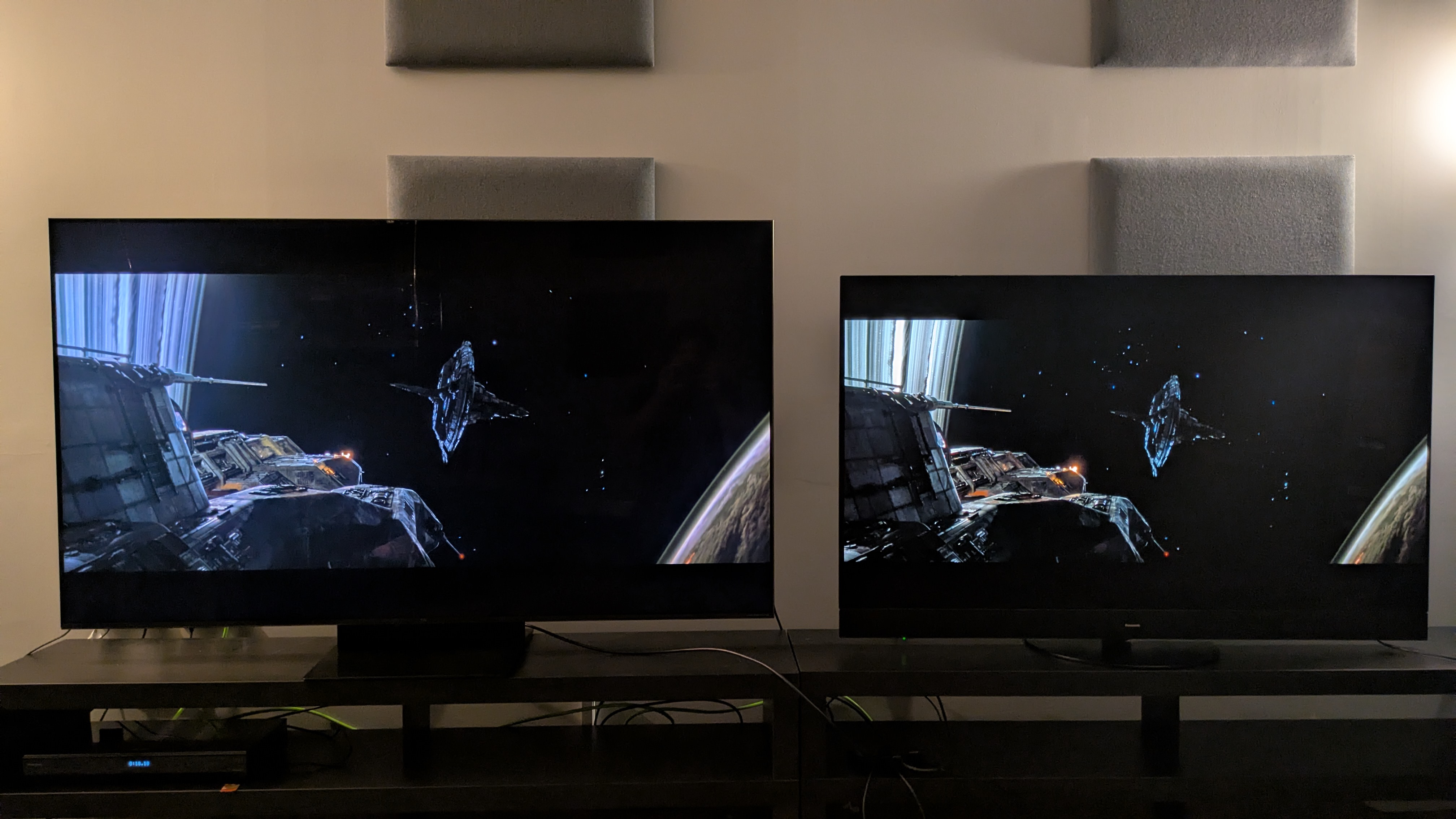 TCL C7K mini-LED left and Panasonic MZ1500 OLED right displaying a space scene from Alien:Romulus on screen