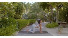 woman does yoga outdoors