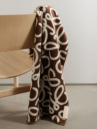 a brown and white printed beach towel