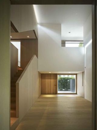 The triple-height entrance hall acts as the house's heart