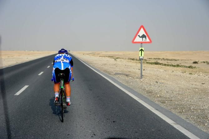 A rider from the Italian national team chases down the lonely road