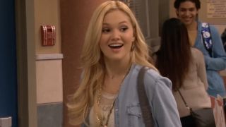 Olivia Holt playing Lindy Watson in the hallways of I Didn't Do It.