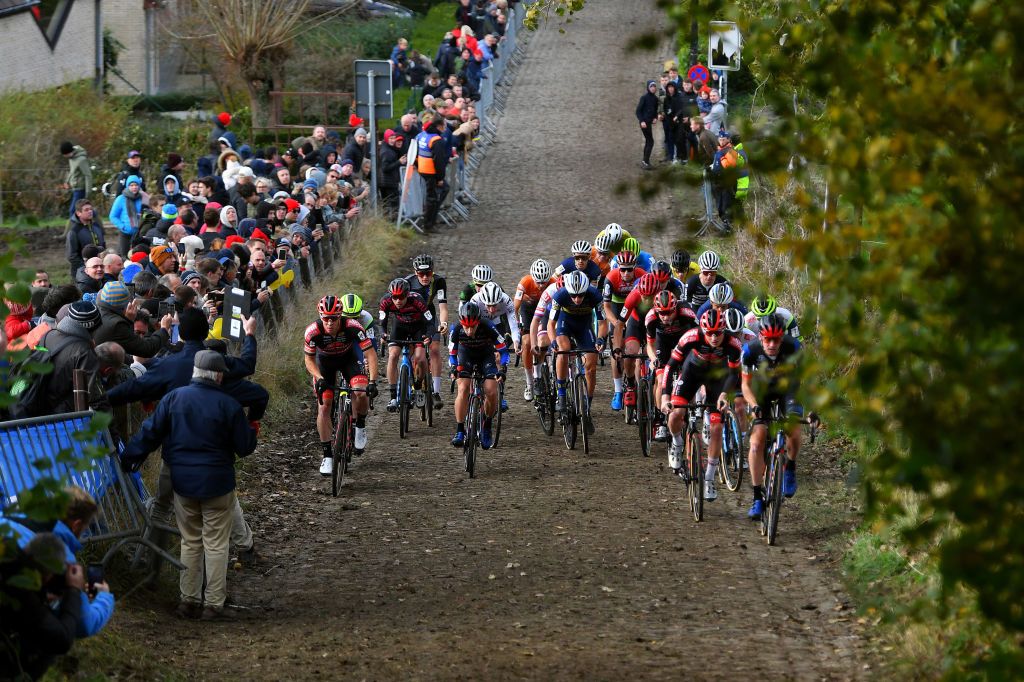 OUDENAARDE BELGIUM NOVEMBER 01 LR Laurens Sweeck of Belgium and Team Pauwels Sauzen Bingoal Lars Van Der Haar of The Netherlands and Team Baloise Trek Lions Lander Loockx of Belgium and Team DeschachtGroup HensContainers Maes Toon Vandebosch of Belgium and Team Pauwels Sauzen Bingoal and Toon Aerts of Belgium and Team Baloise Trek Lions lead The Peloton at start during the 32nd Koppenbergcross Grand Prix Jolien Verschueren 2021 Mens Elite Koppenbergcross Oudenaarde X2OBadkamersTrofee on November 01 2021 in Oudenaarde Belgium Photo by Luc ClaessenGetty Images