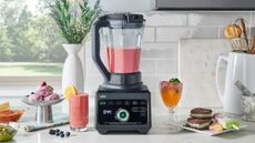 Braun TriForce Power Blender on the countertop with smoothies and drinks around it