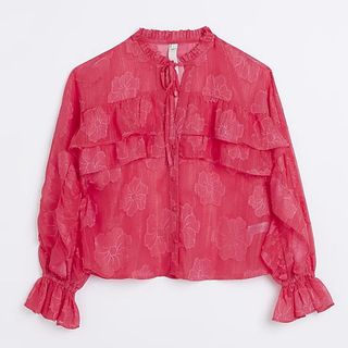 pink floral blouse with ruffle across bust