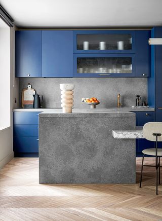 modern kitchen with stone island and blue kitchen cupboards