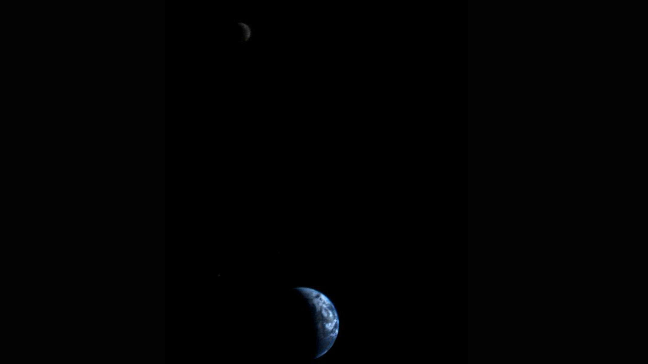 This picture of a crescent-shaped Earth and Moon, the first of its kind ever taken by a spacecraft, was recorded Sept. 18, 1977, by NASA's Voyager 1 when it was 7.25 million miles (11.66 million kilometers) from Earth. Credit: NASA/JPL