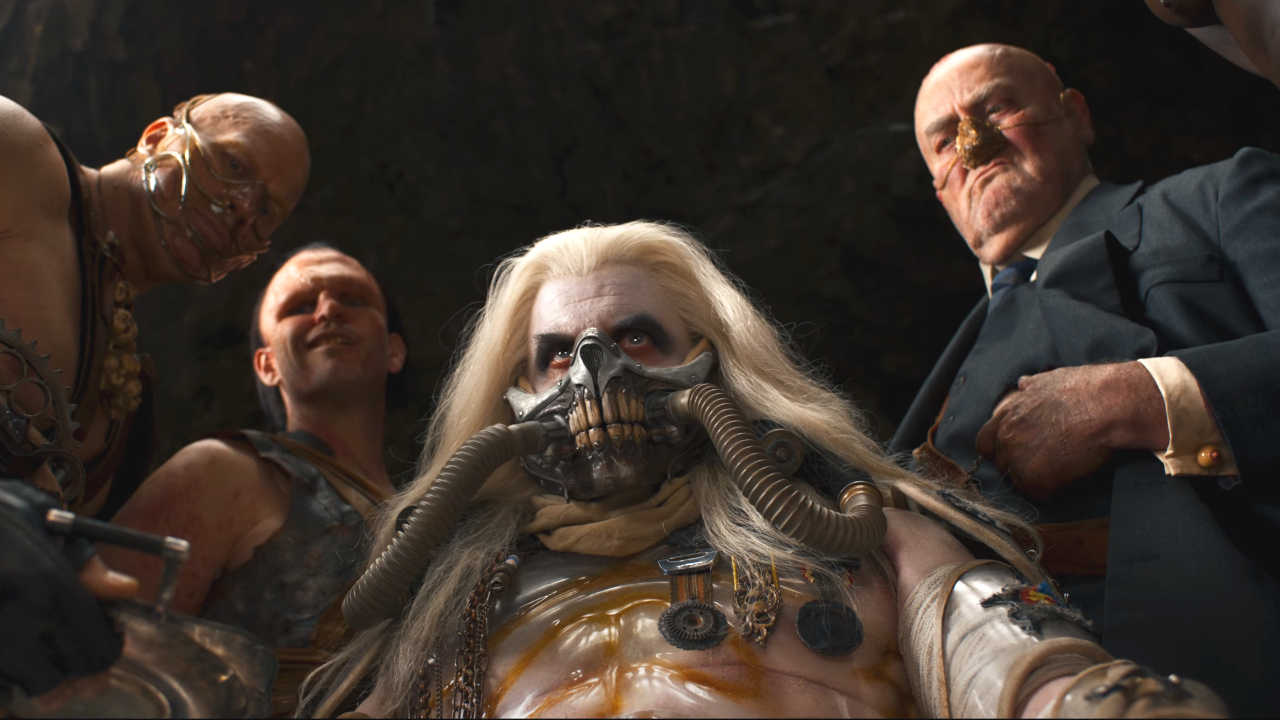 Immortan Joe surrounded by his companions in Furiosa: A Mad Max Saga.