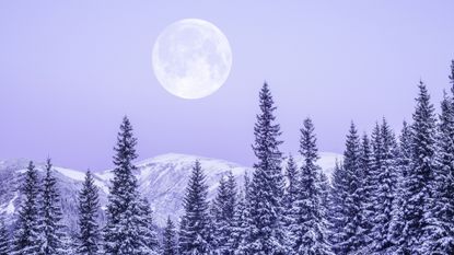 Winter Solstice 2022: Moonrise in snowy mountains.