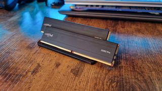 two Crucial DDR5 Pro RAM modules on a stand