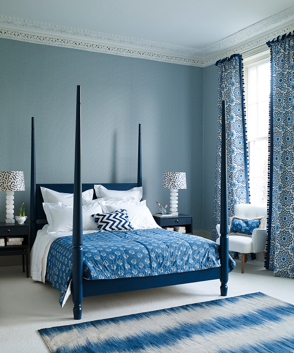 Blue bedroom ideas featuring a large four poster bed