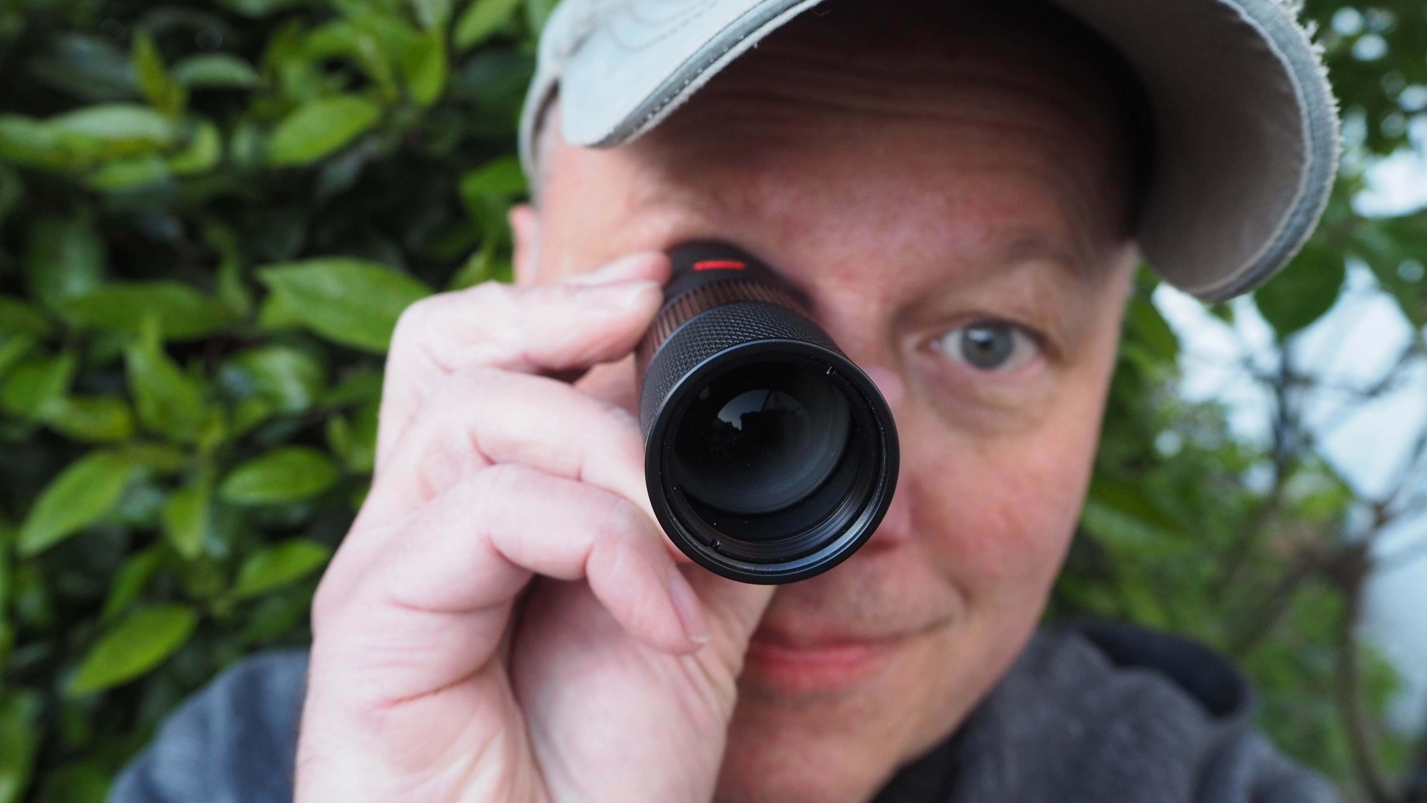 Person looking through a Leica Monovid 8x25 monocular