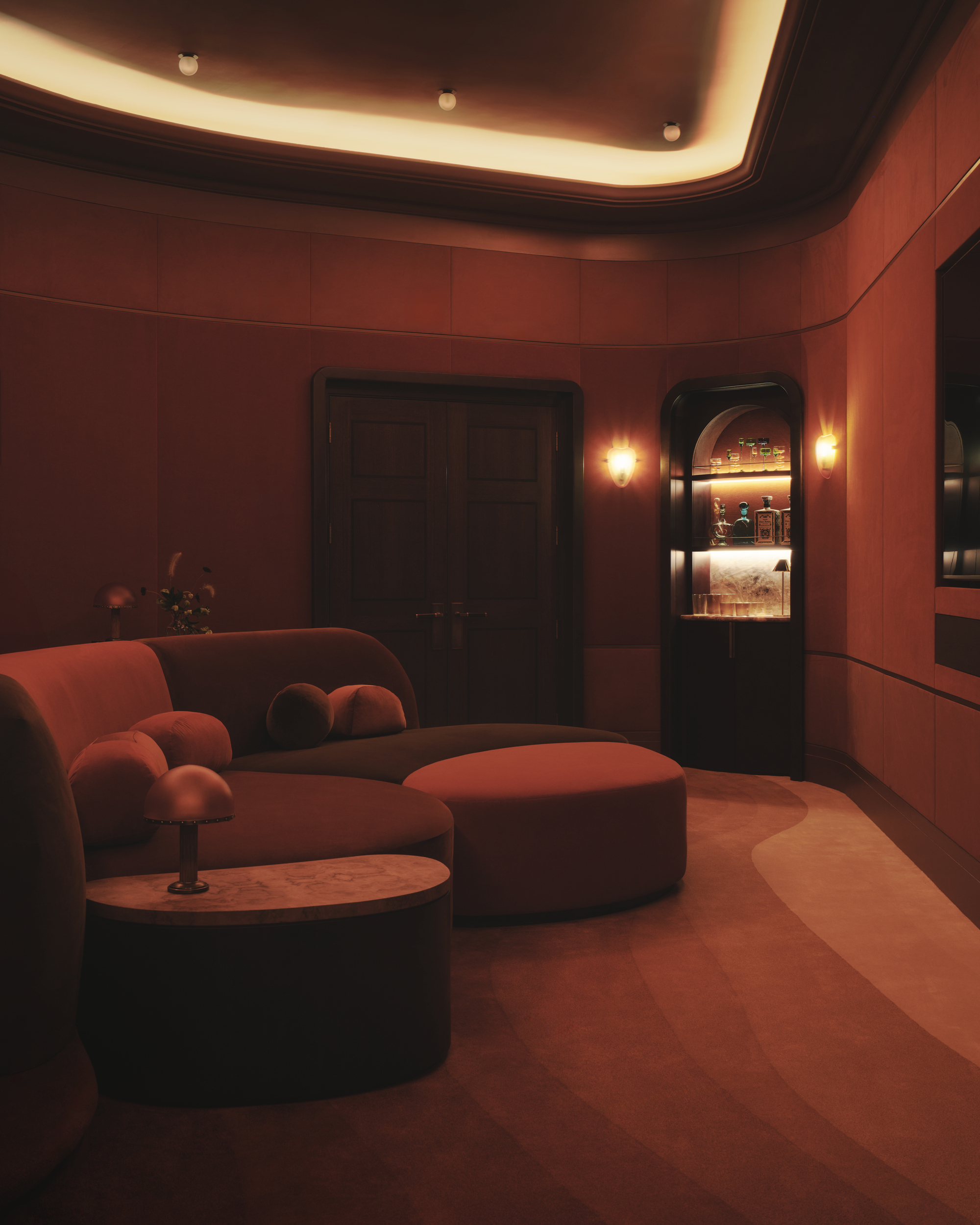A clour-drenched cinema room using red-on-red tones.