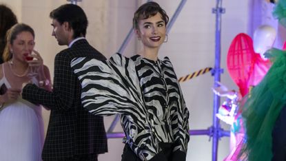 Emily in Paris season 3 scene of Emily (Lily Collins) in a zebra like jacket at a party