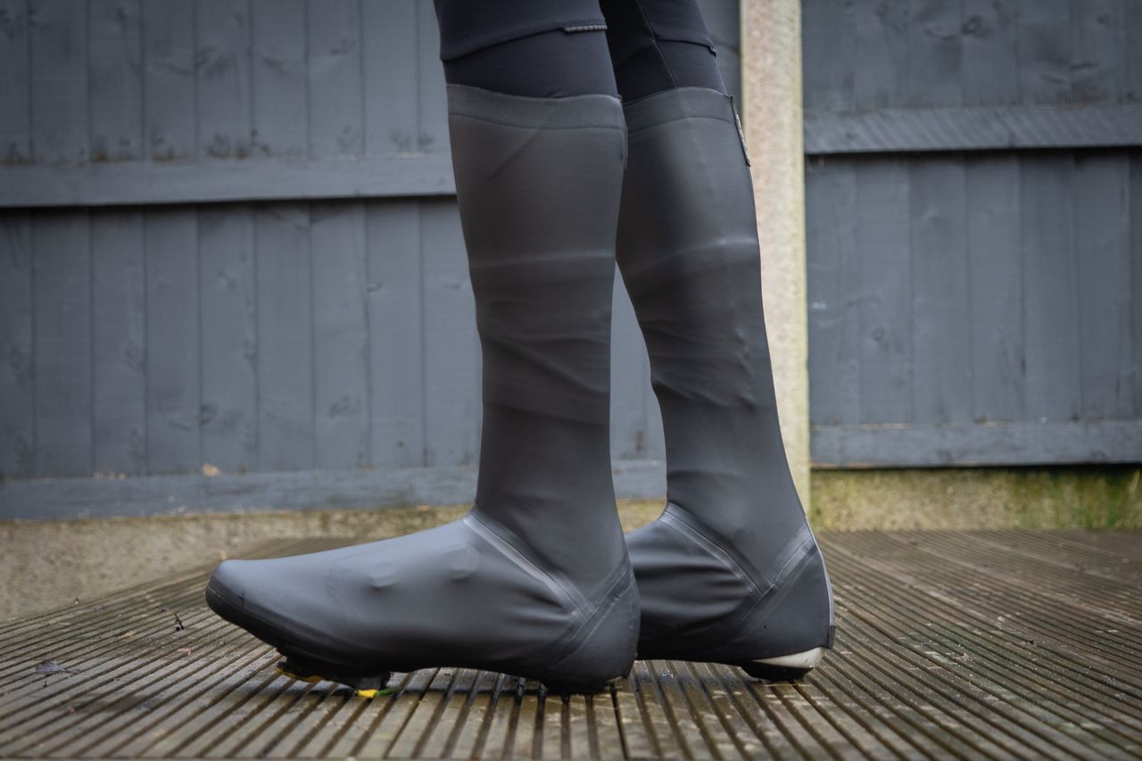 A rider wearing the GripGrab Aquashield overshoes