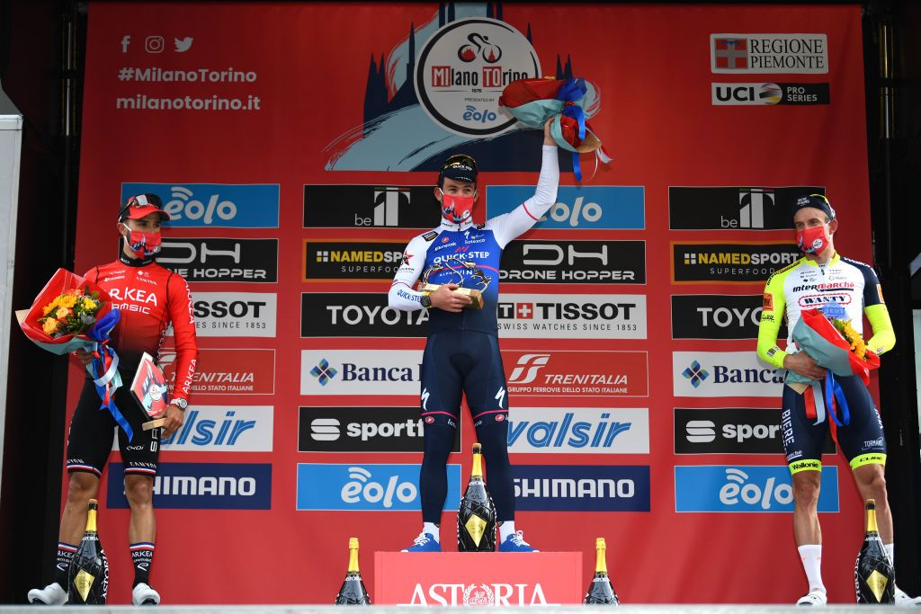 MILAN ITALY MARCH 16 LR Nacer Bouhanni of France and Team Arka Samsic on second place race winner Mark Cavendish of United Kingdom and Team QuickStep Alpha Vinyl and Alexander Kristoff of Norway and Team Intermarch Wanty Gobert Matriaux on third place pose on the podium ceremony after the 103rd MilanoTorino 2022 a 197km one day race from Magenta to Rivoli MilanoTorino on March 16 2022 in Milan Italy Photo by Tim de WaeleGetty Images