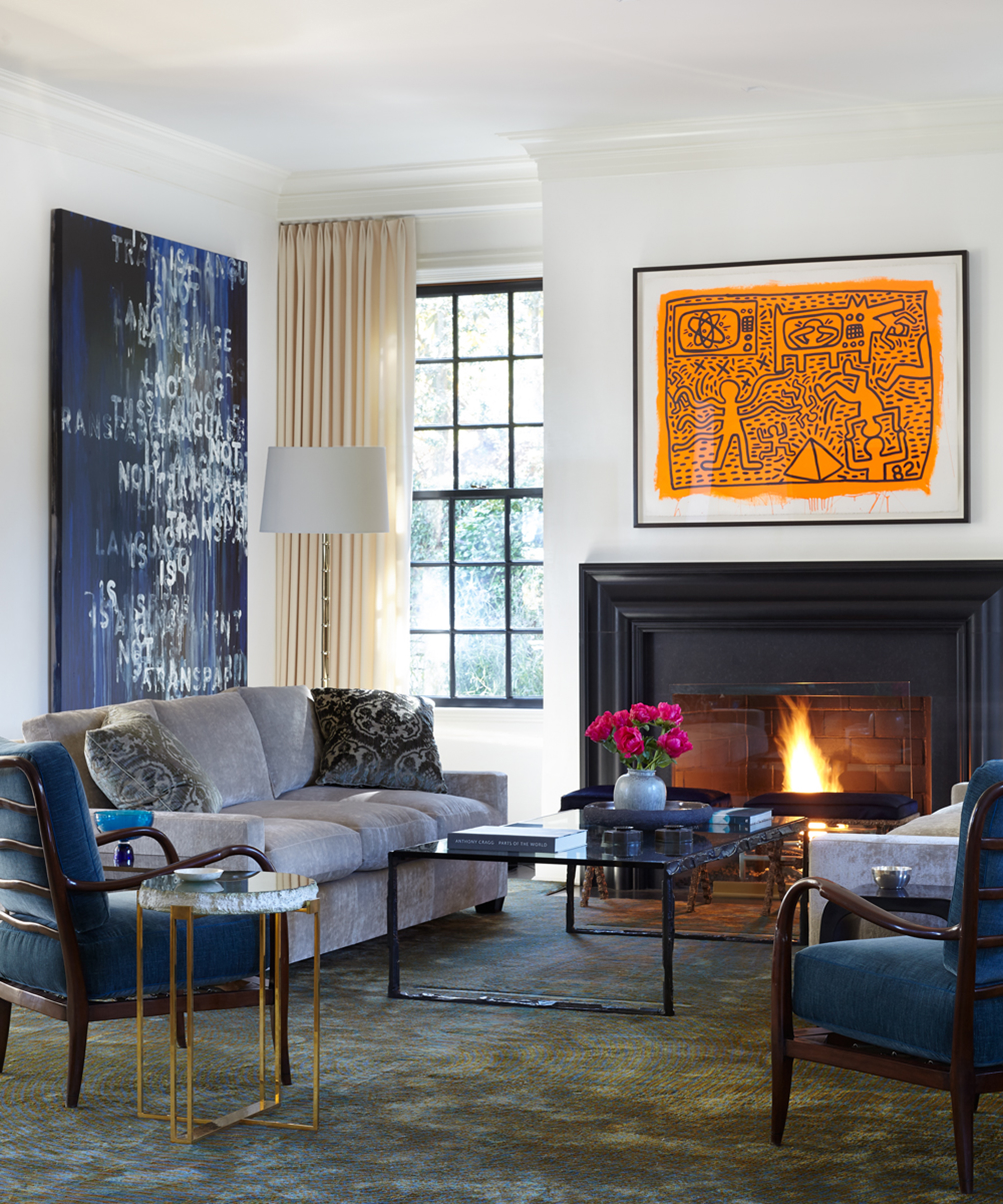 living room with fireplace and contrasting modern art