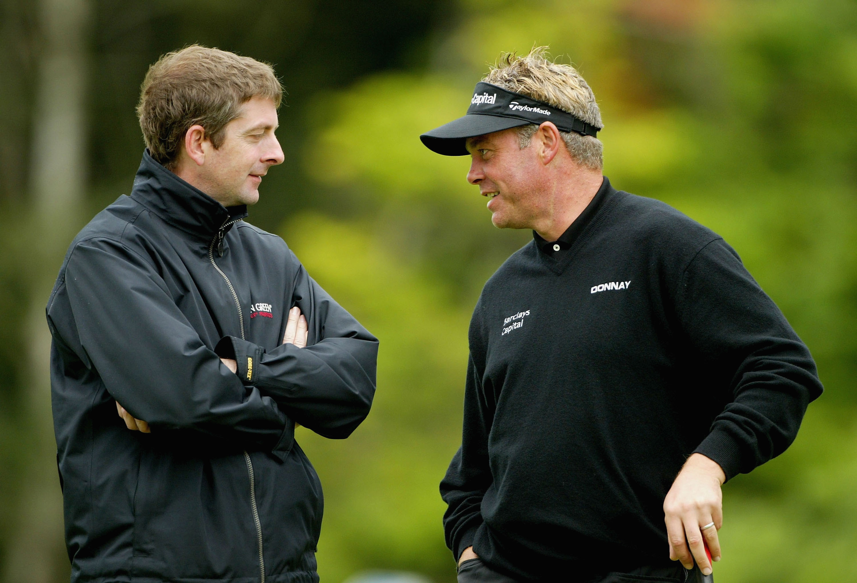 Karl Morris and Darren Clarke talk during the 2004 European Open