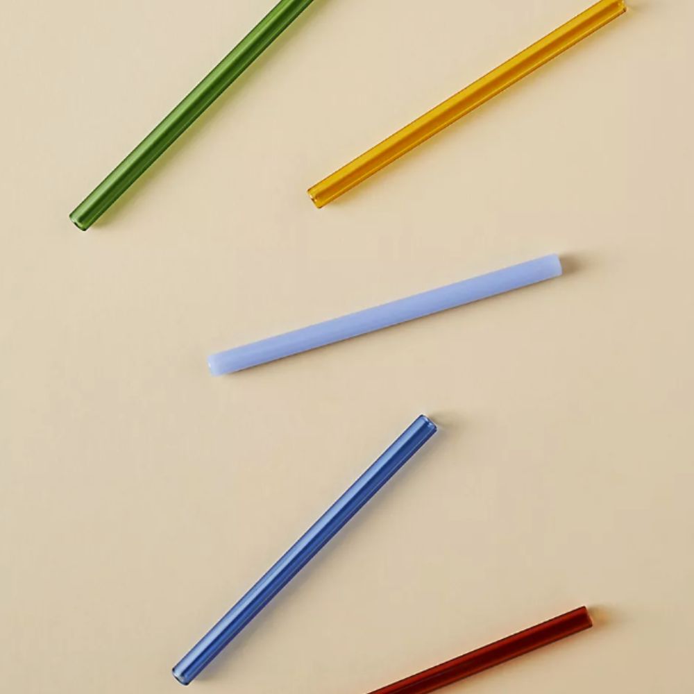 colored glass straws on a cream background