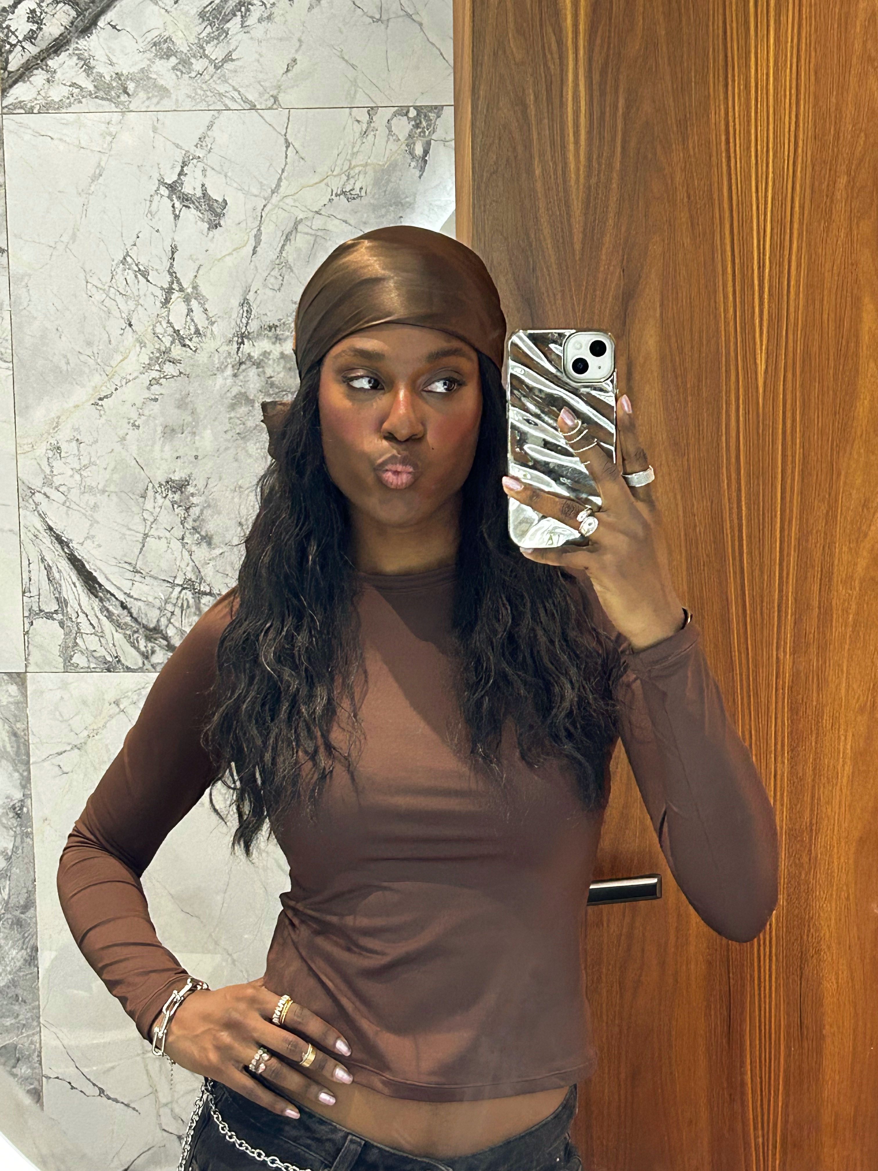 Shei Mamona wearing a silk scarf