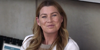 Grey's Anatomy Meredith Gray sits on a bench.