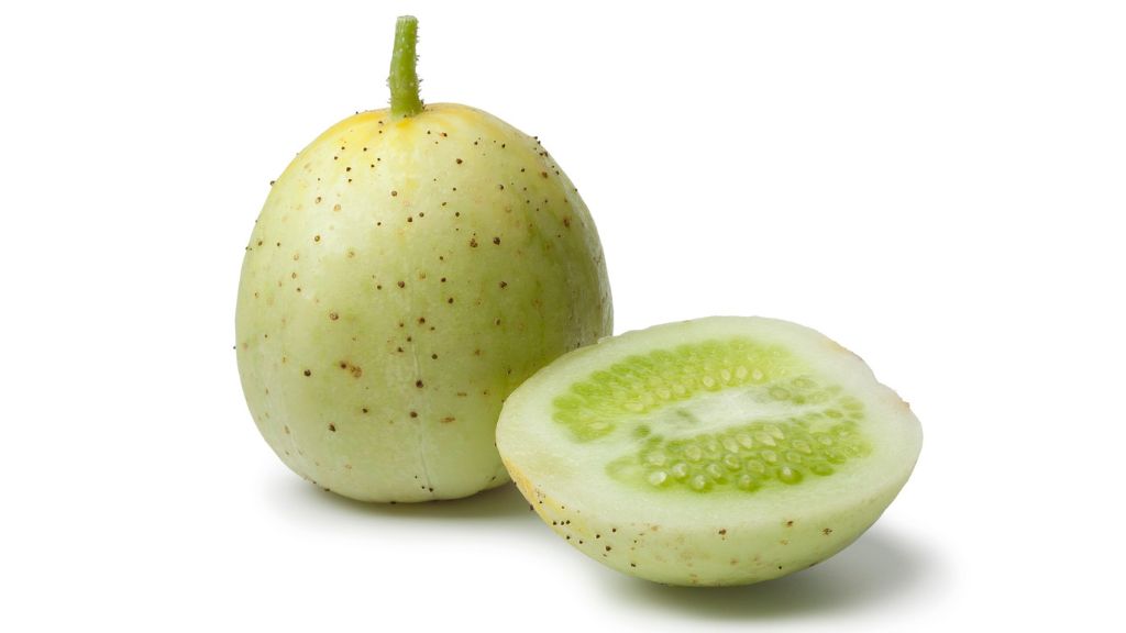 isolated whole and halved apple cucumber 