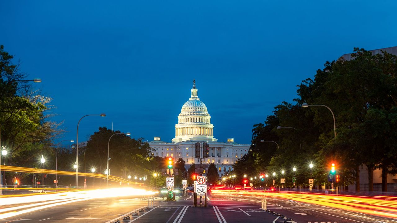 The United States Capitol building at night in Washington DC, USA.